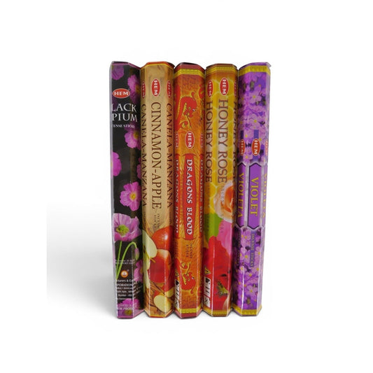 The Witches' Quest HEM incense variety pack featuring five hexagonal boxes of assorted floral and spicy scents.
