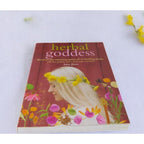 The Witches' Quest Herbal Goddess softcover book by Amy Jirsa featuring a woman with a yellow flower crown