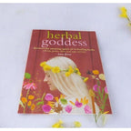 The Witches' Quest Herbal Goddess softcover book by Amy Jirsa featuring a woman with a yellow flower crown