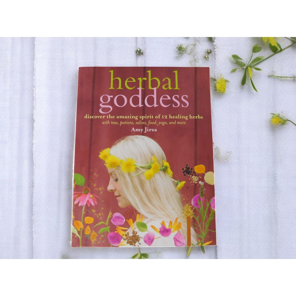 The Witches' Quest Herbal Goddess softcover book by Amy Jirsa featuring floral illustrations and holistic healing guide
