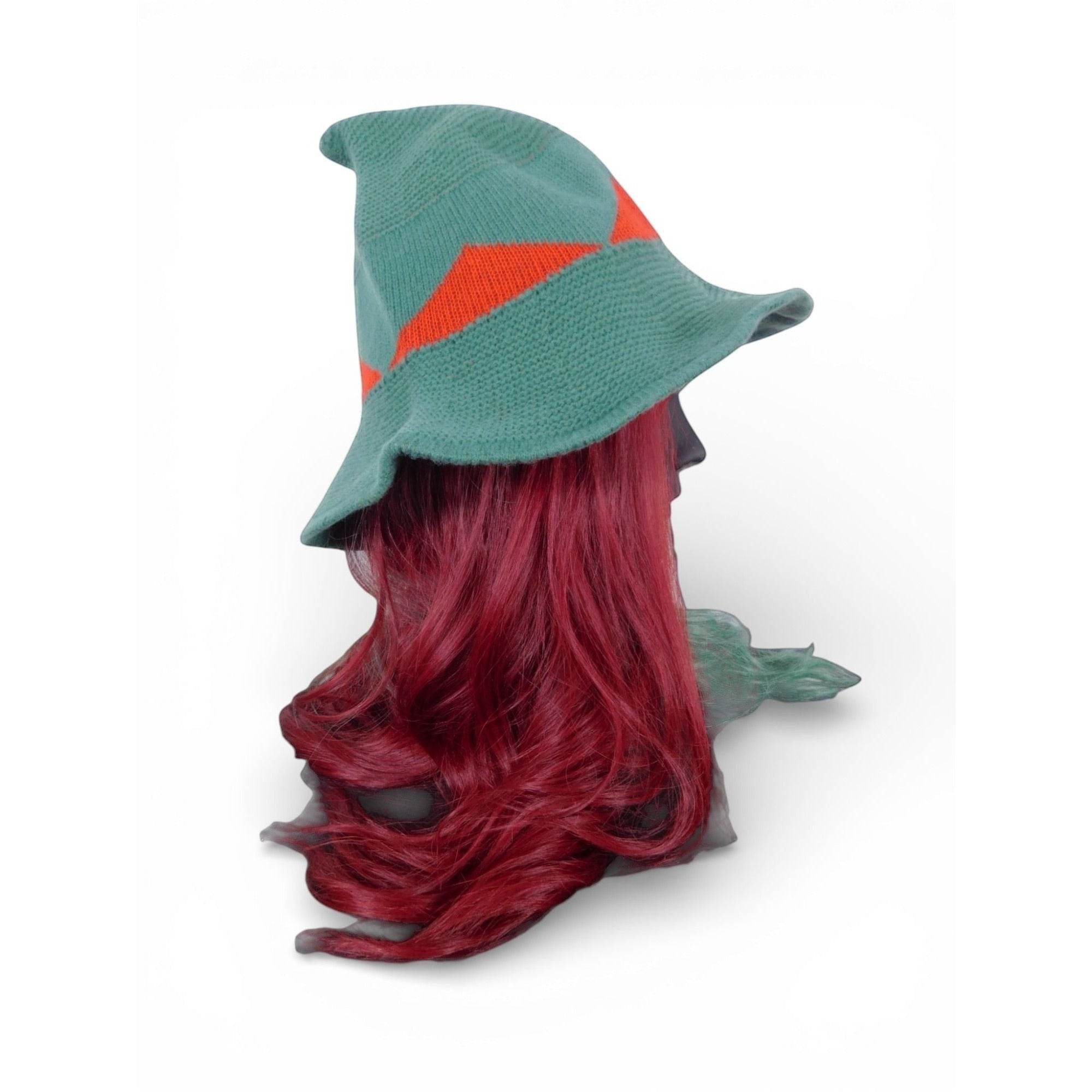 The Witches' Quest green and red color block knitted witch hat with a wide brim and pointed tip on a mannequin head.