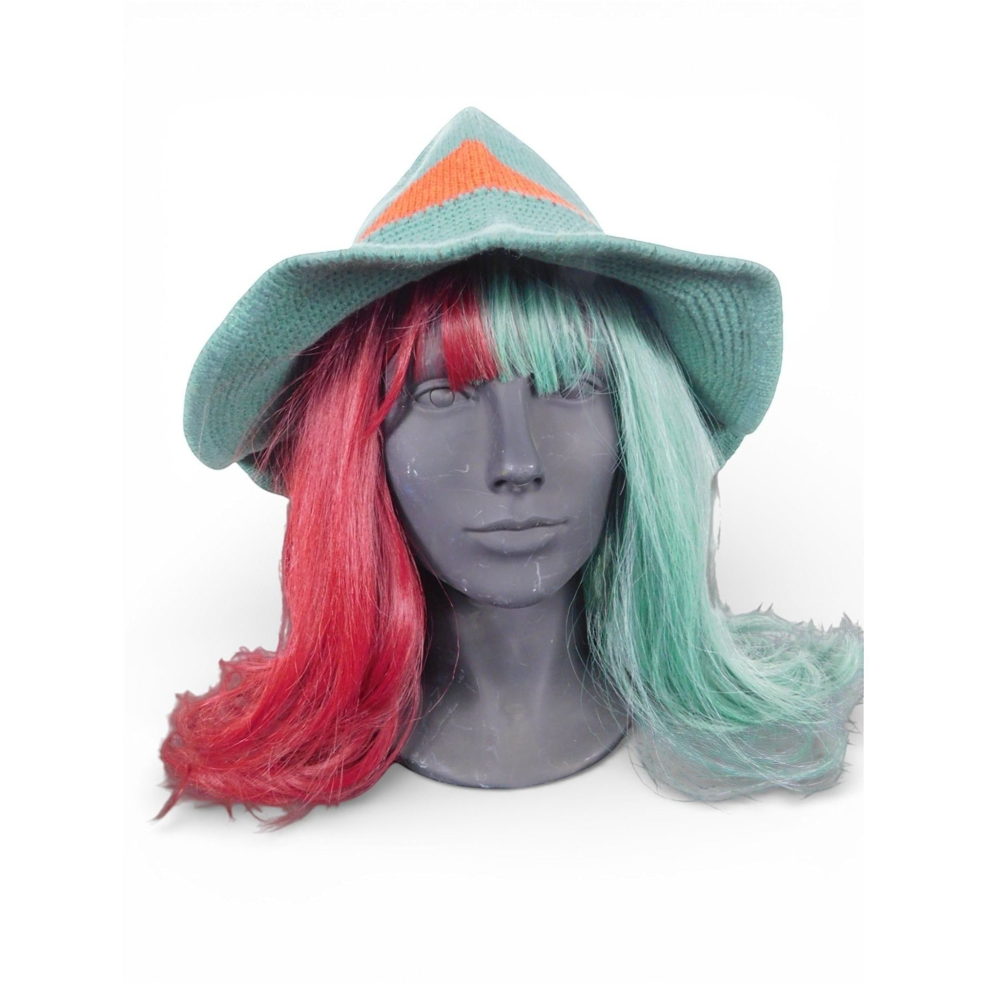 The Witches' Quest knitted witch hat in green and red color block with a wide brim on a mannequin with two-tone hair.