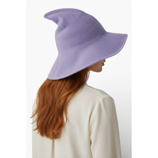 The Witches' Quest lavender purple knit witch hat with a wide brim and pointed silhouette worn by a woman.