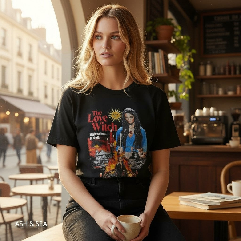 The Witches' Quest black cotton unisex t-shirt featuring a vibrant The Love Witch graphic print worn by a woman.