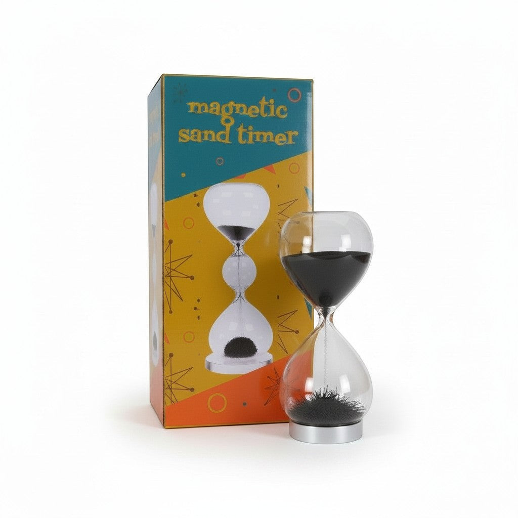 The Witches' Quest magnetic sand timer with black iron filings in clear glass beside its retro-style decorative box.