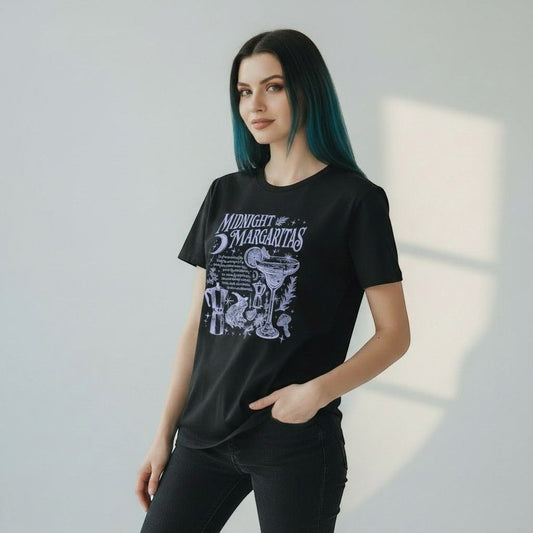 The Witches' Quest black cotton crewneck t-shirt featuring a white Midnight Margaritas celestial cocktail graphic.