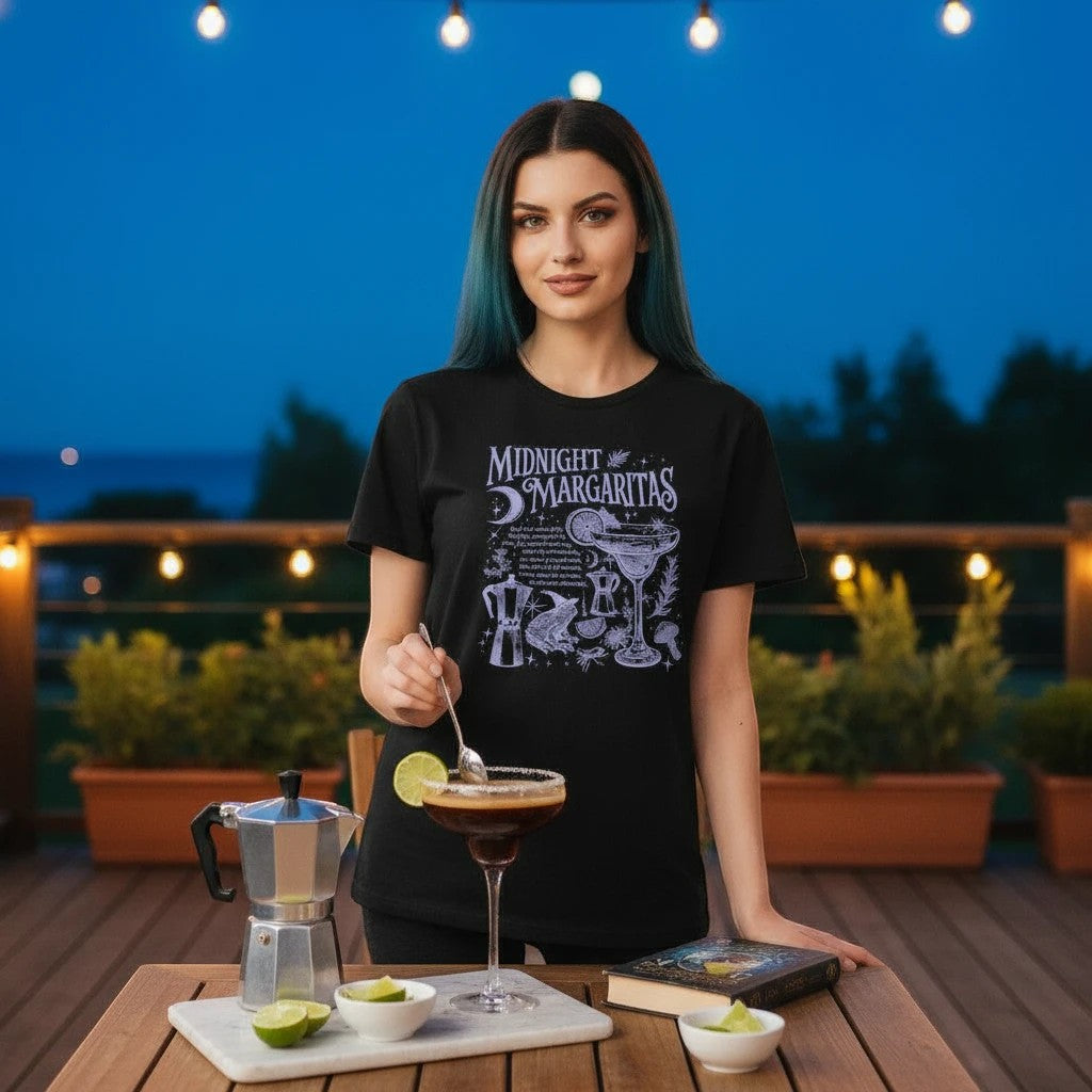 The Witches' Quest black cotton crewneck t-shirt featuring a white Midnight Margaritas graphic print on a woman.