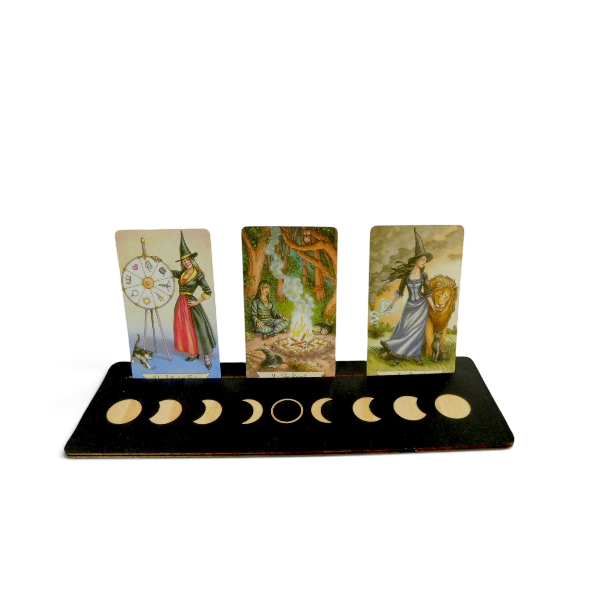 The Witches' Quest wooden moon phase tarot card display stand holding three oracle cards on a white background.