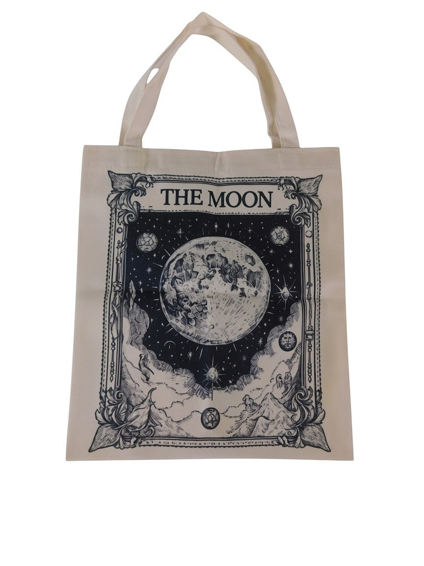 The Witches' Quest canvas tote bag featuring a detailed black and white illustration of The Moon tarot card design.