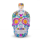 The Witches' Quest clear glass skull decanter with vibrant hand-painted floral and heart designs for altar decor.