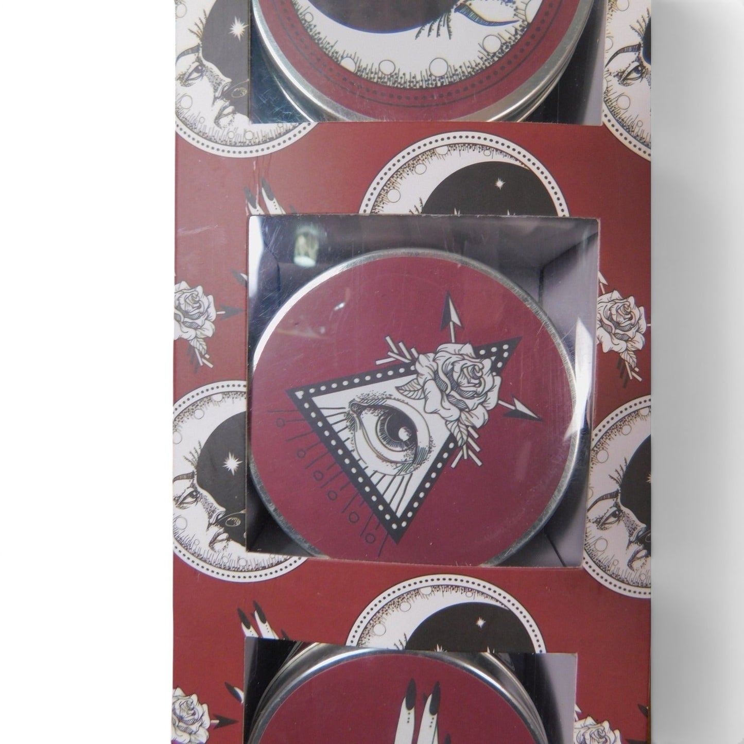 The Witches' Quest I Am The Universe pomegranate noir scented candle set in celestial-themed travel tins.