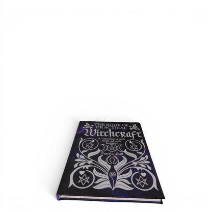 The Witches' Quest hardcover copy of The Book of Practical Witchcraft with a dark purple cosmic cover design.