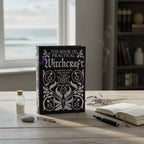 The Witches' Quest hardcover copy of The Book of Practical Witchcraft by Pamela Ball on a wooden desk with incense.