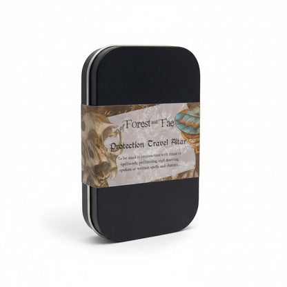 The Witches' Quest Protection Travel Altar kit in a black metal tin with a decorative label on a white background.