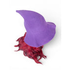 The Witches' Quest purple knit witch hat with a wide brim and pointed top, worn over vibrant red hair.