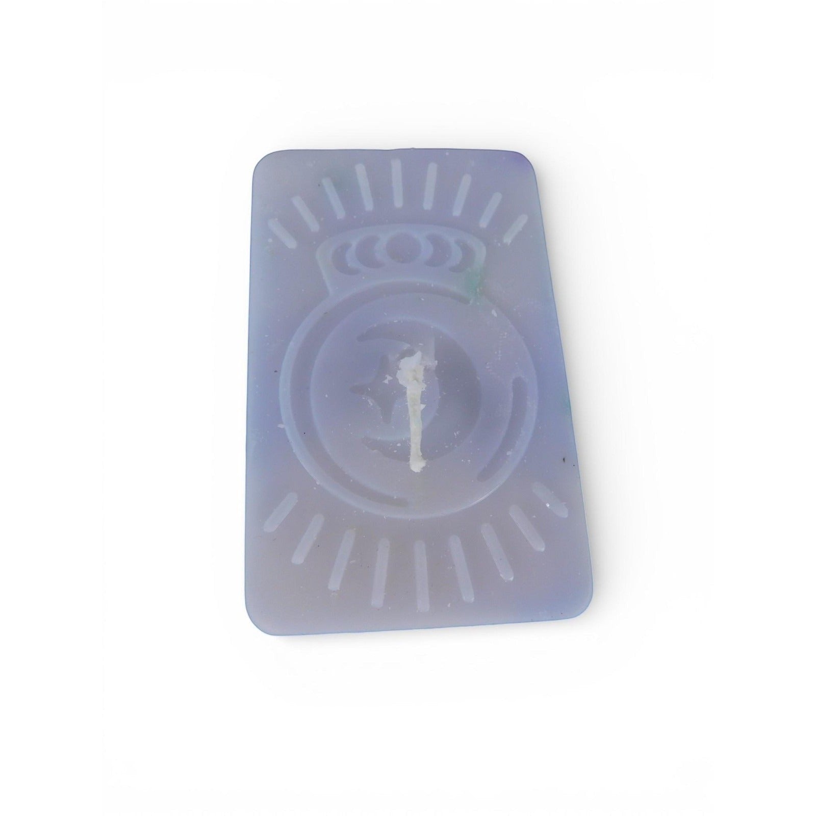 The Witches' Quest handmade purple rectangular wax candle with an embossed celestial moon and sun ray emblem.