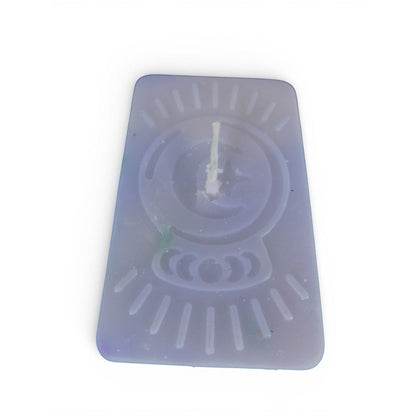 The Witches' Quest purple rectangular wax candle with an embossed celestial moon and sun ray design for altar decor.