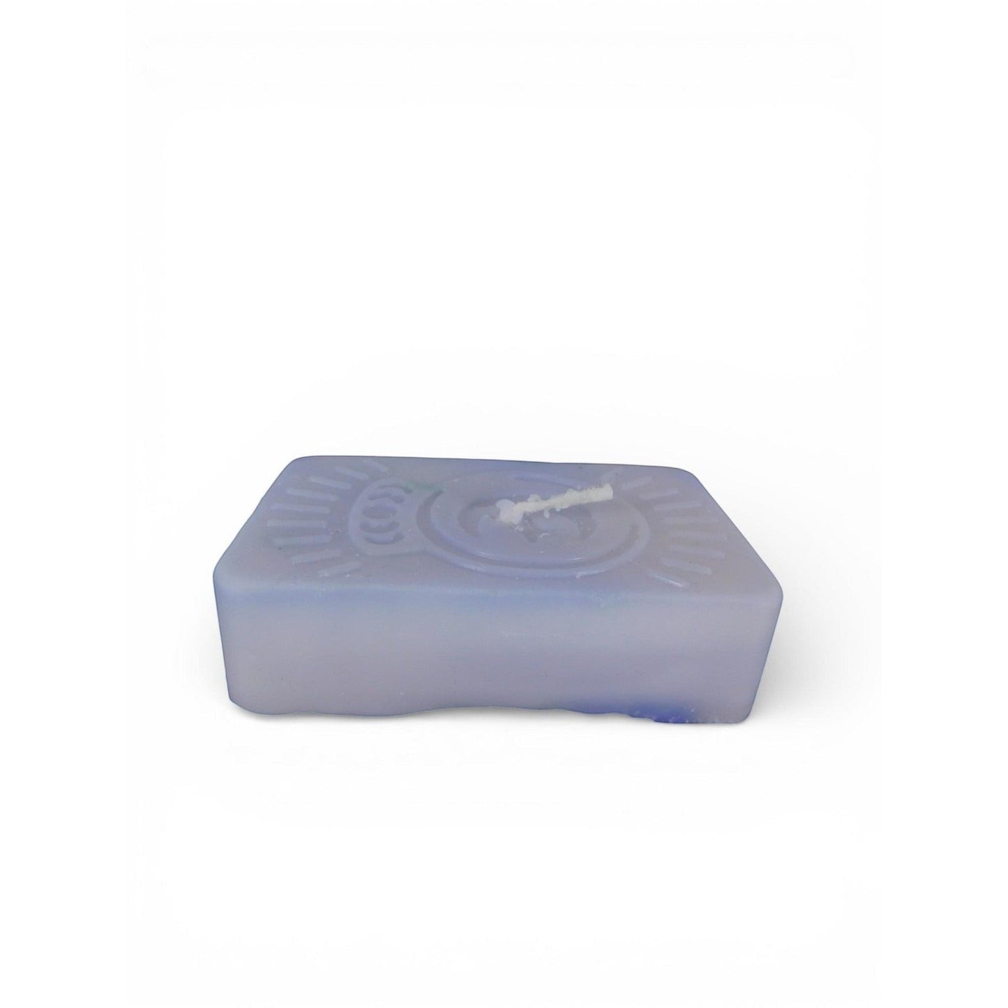 The Witches' Quest purple rectangular wax candle with an embossed celestial moon and sun ray emblem for altar decor.