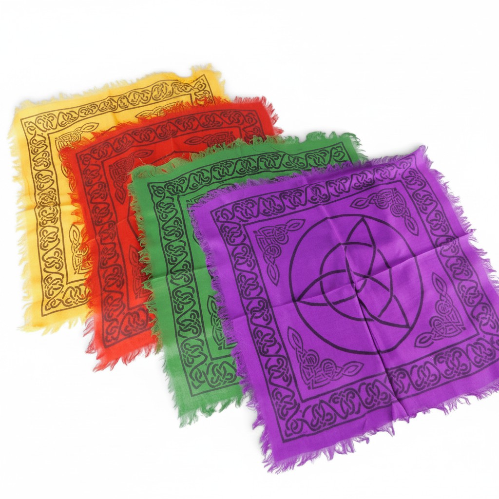 The Witches' Quest set of 4 rainbow altar cloths with black triquetra and Celtic knot prints and fringed edges.