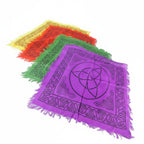 The Witches' Quest set of 4 rainbow altar cloths with black triquetra and Celtic knot prints and fringed edges.