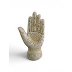 The Witches' Quest 5-inch beige resin palmistry hand sculpture with detailed mystical engravings and antique finish.