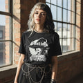 The Witches' Quest black cotton crew neck t-shirt with a white Resting Witch Face graphic worn by a woman