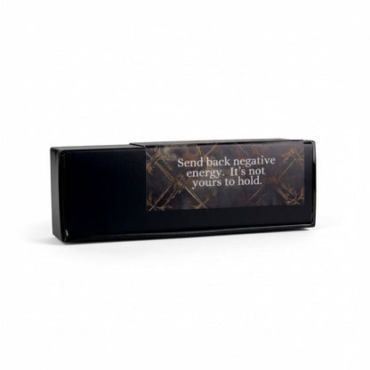 The Witches' Quest Return to Sender ritual kit in a sleek black box with an inspirational label on a white background.