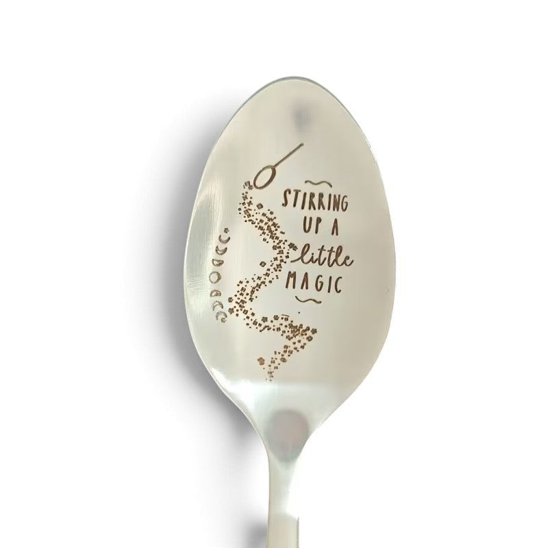 The Witches' Quest silver ritual spoon engraved with the text Stirring up a little magic and moon phase symbols