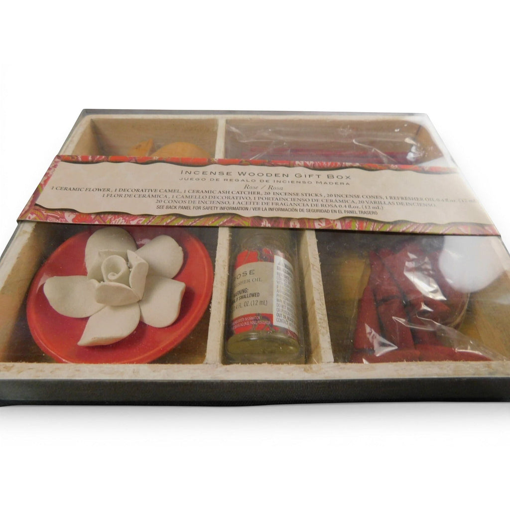 The Witches' Quest rose incense gift set with ceramic flower ash catcher, fragrance oil, and sticks in a wooden box.