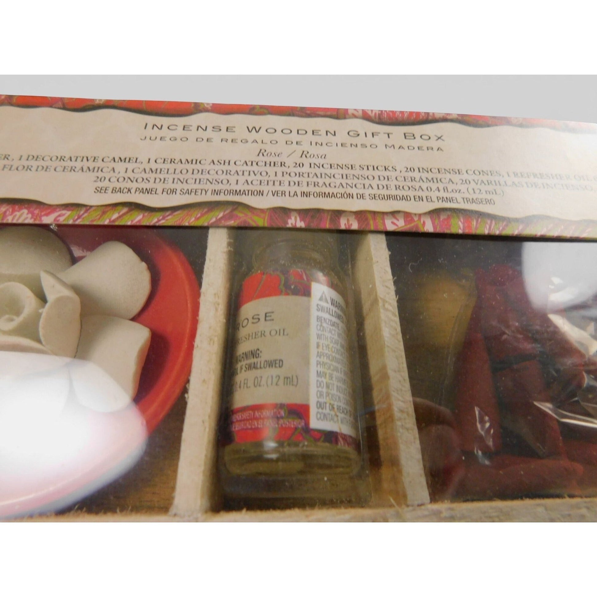 The Witches' Quest incense gift set featuring rose fragrance oil, ceramic flower, and incense sticks in a wooden box