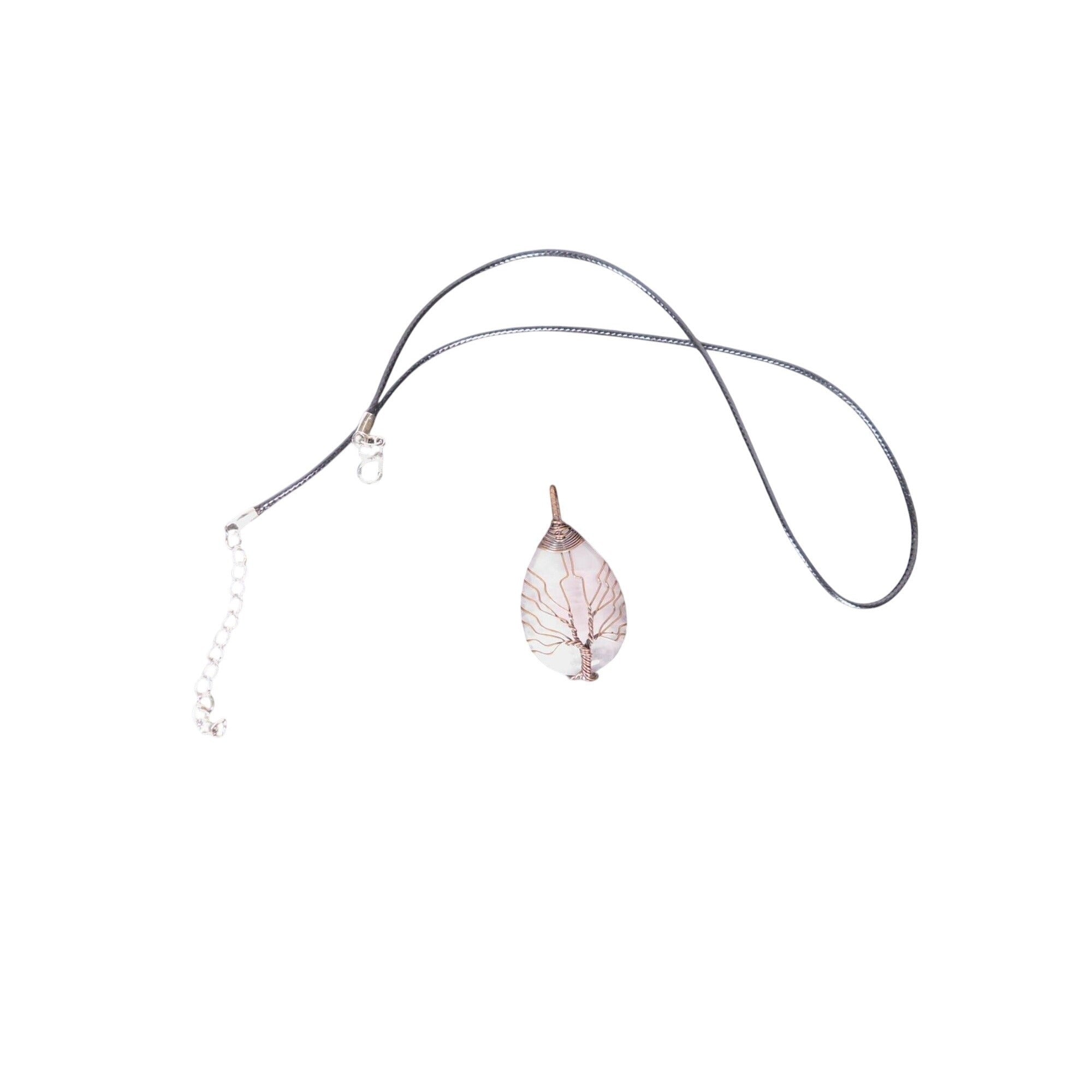 The Witches' Quest rose quartz teardrop pendant with copper wire wrapped tree of life design on a black cord necklace.
