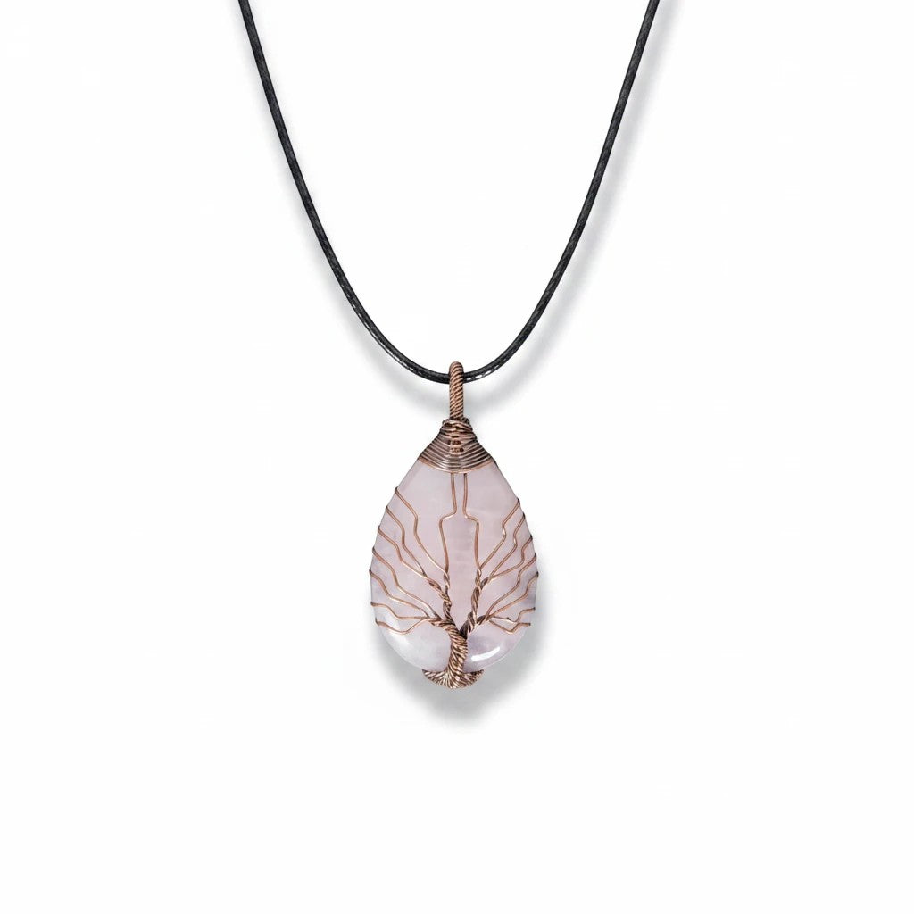 The Witches' Quest rose quartz teardrop pendant necklace with a copper wire wrapped tree of life design on a black cord