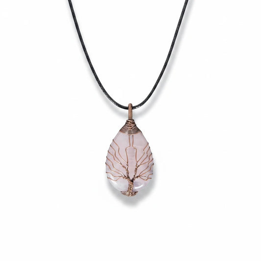 The Witches' Quest rose quartz teardrop pendant necklace with a copper wire wrapped tree of life design on a black cord