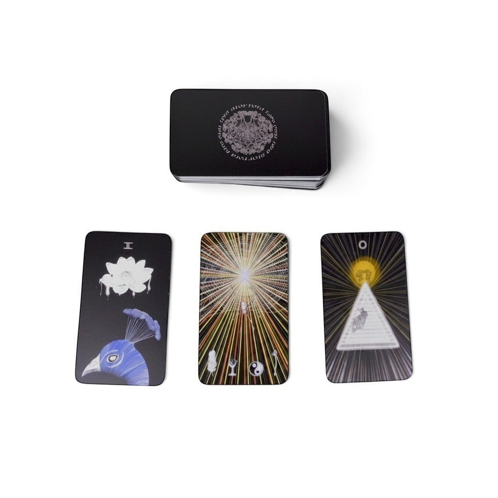 The Witches' Quest The Sacred Web tarot deck featuring dark charcoal cards with mystical cosmic and nature illustrations