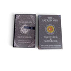The Witches' Quest The Sacred Web tarot deck and guidebook set in a dark charcoal box with rainbow mandala artwork.