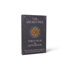 The Witches' Quest The Sacred Web tarot deck and guidebook set in a dark charcoal gray illustrated keepsake box.