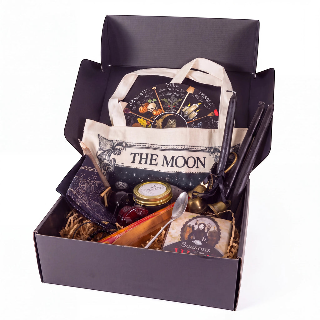 The Witches' Quest Samhain altar bundle in a box with oracle deck, obsidian, ritual tools, and moon tote bag.