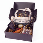 The Witches' Quest Samhain altar bundle in a box with oracle deck, obsidian, ritual tools, and moon tote bag.