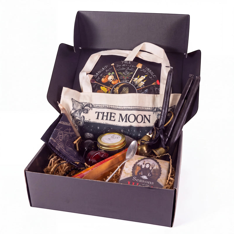 The Witches' Quest Samhain altar bundle in a box with oracle deck, obsidian, ritual tools, and moon tote bag.