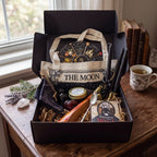 The Witches' Quest Samhain altar bundle in a black box containing an oracle deck, ritual tools, candles, and tote bag.