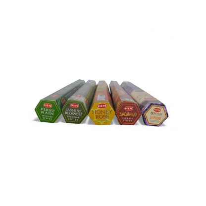 The Witches' Quest self-love incense pack featuring five hexagonal tubes of HEM incense sticks in assorted scents.