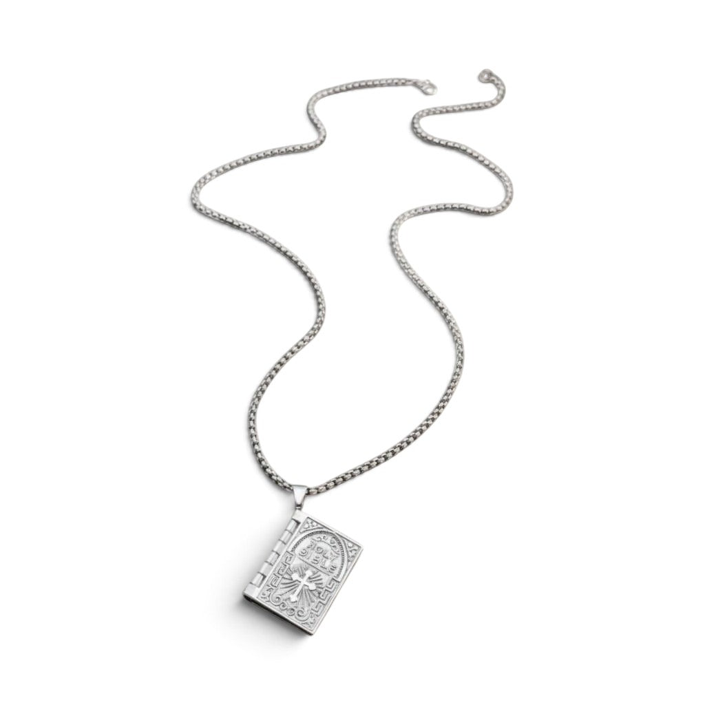 The Witches' Quest silver tone rectangular Bible locket pendant necklace with a cross and 26-inch chain.