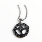 The Witches' Quest silver tone St. Brigid’s Cross pendant necklace featuring a woven design inside a circular frame.
