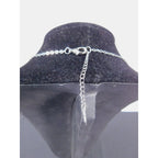 The Witches' Quest silver tone cable chain necklace with lobster claw clasp and extender on a black display bust