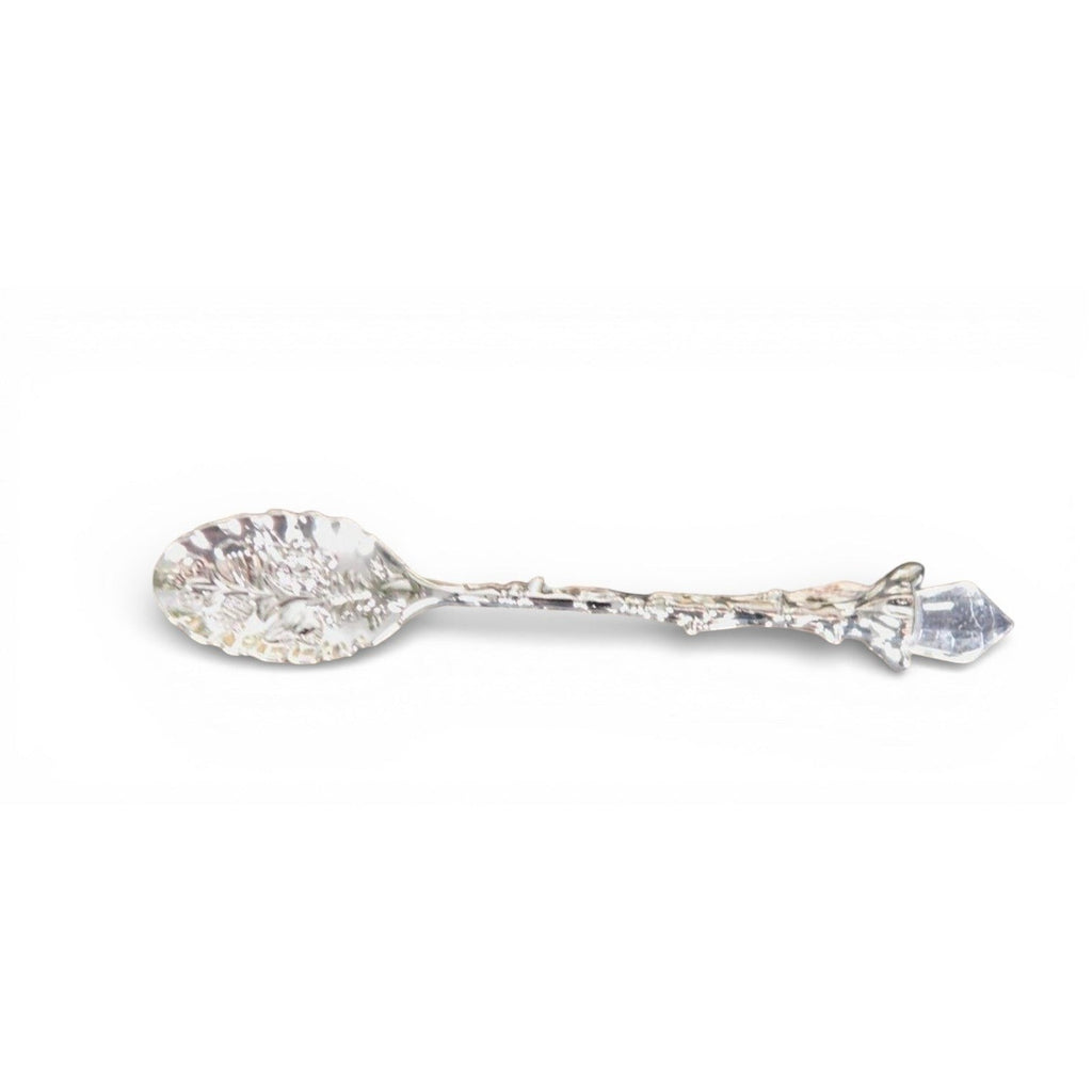 The Witches' Quest silver alloy teaspoon featuring an ornate leaf-shaped bowl and a twig handle with a crystal point.