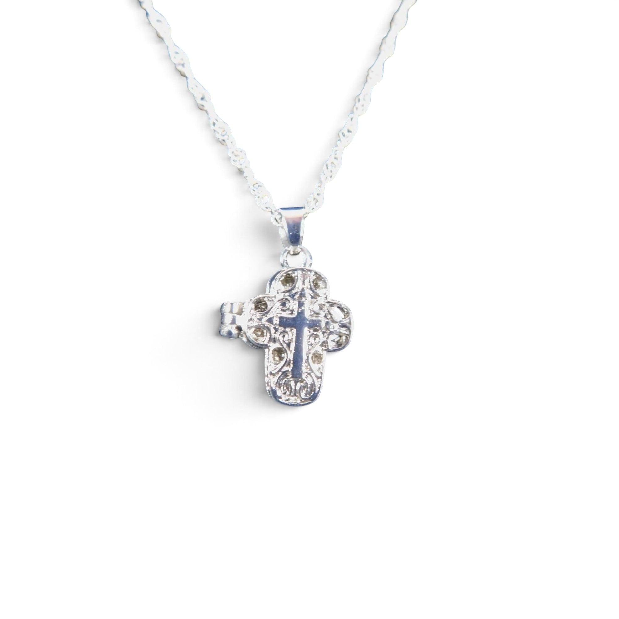 The Witches' Quest silver-tone alloy cross locket necklace with intricate floral filigree and a magnetic closure.