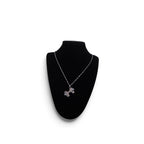 The Witches' Quest silver-tone alloy cross locket necklace with intricate floral filigree and magnetic closure.