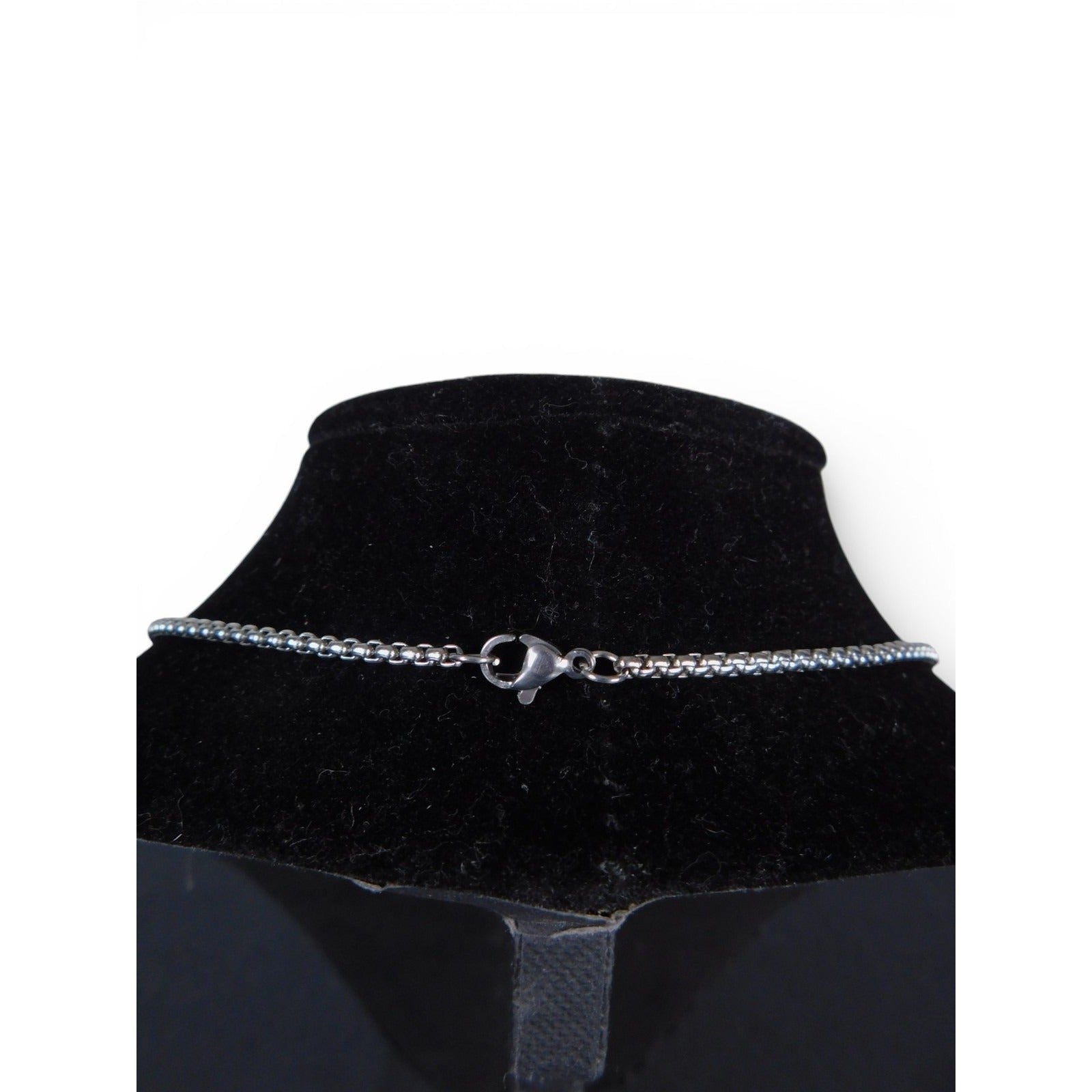 The Witches' Quest silver tone necklace chain featuring a secure lobster claw clasp on a black display bust