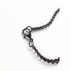 The Witches' Quest silver tone necklace featuring a durable link chain and a secure lobster claw clasp closure.
