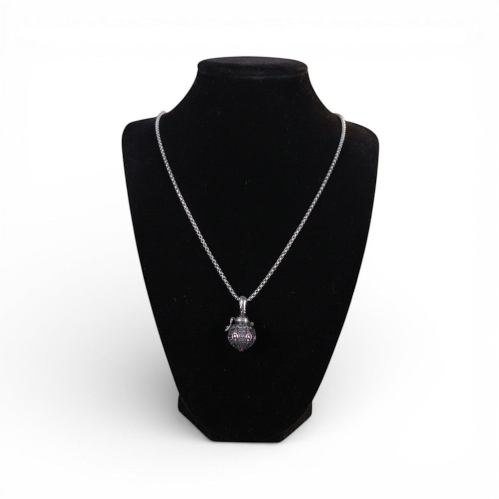 The Witches' Quest silver tone Victorian poison box locket necklace with textured wings on a black display bust